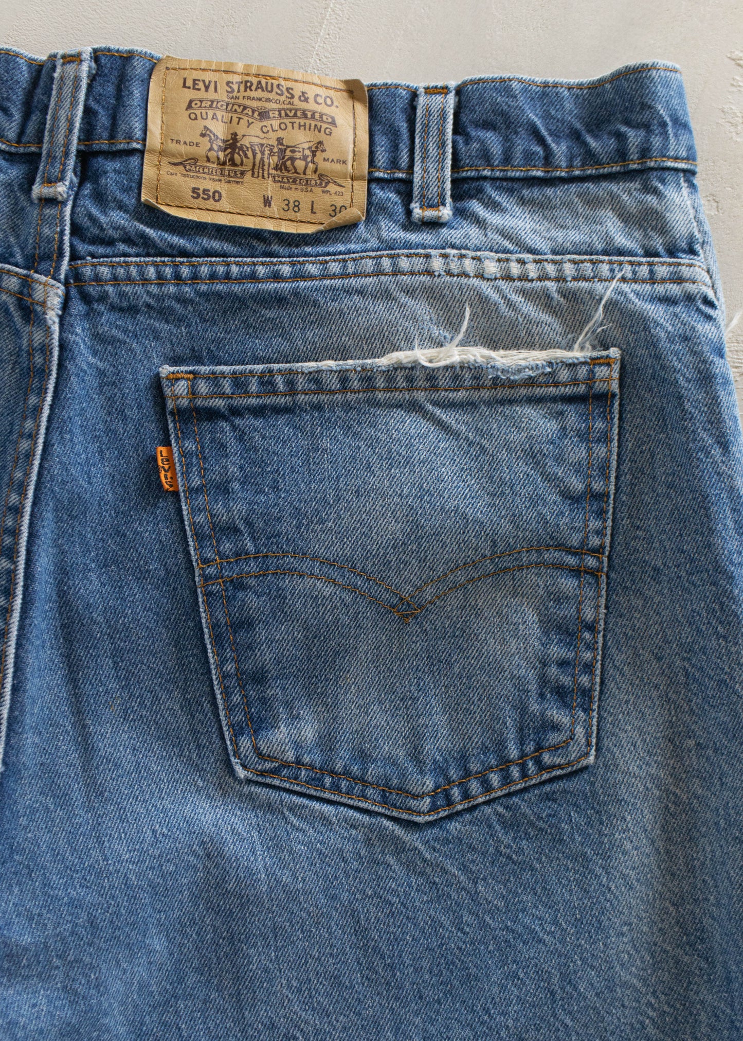 1980s Levi's 550 Orange Tab Midwash Jeans Size Women's 33 Men's 36